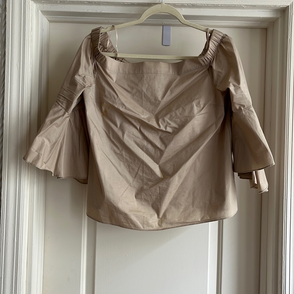 Jennifer Lopez cream off the shoulder flare top